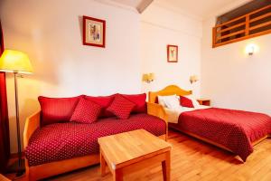 Postel nebo postele na pokoji v ubytování Grand Hotel Ifrane