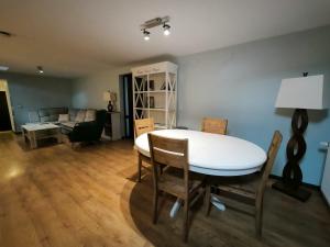 a living room with a table and chairs and a couch at Castelul Stirbey in Sinaia