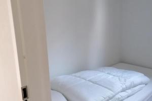 Ένα ή περισσότερα κρεβάτια σε δωμάτιο στο Modern gezinsvriendelijke chalet op de Veluwe +8 φωτογραφίες