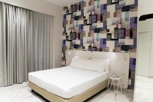 Postel nebo postele na pokoji v ubytování Soul Art Hotel