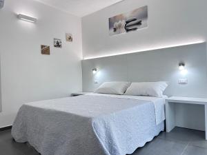 Postel nebo postele na pokoji v ubytování Longevity Hotel