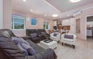 a living room with a couch and a table at Amazing Home In Zadar With Wifi in Zadar