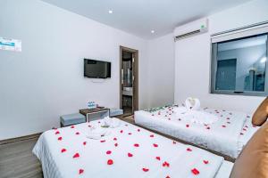 Postel nebo postele na pokoji v ubytování The Shann Hotel Danang