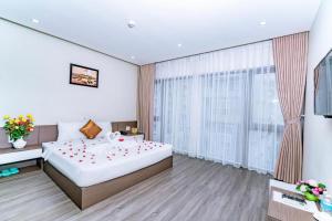 Postel nebo postele na pokoji v ubytování The Shann Hotel Danang