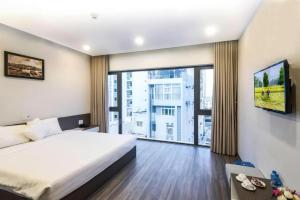 Postel nebo postele na pokoji v ubytování The Shann Hotel Danang