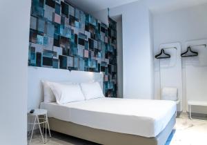 Postel nebo postele na pokoji v ubytování Soul Art Hotel