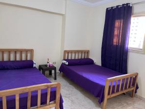 Postel nebo postele na pokoji v ubytování Taher Cairo hostel