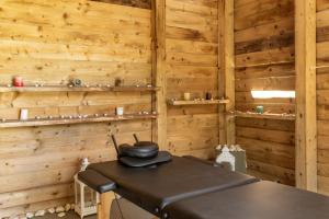a room with a table in a wooden cabin at Ow Andros Suite 1,Private Whirlpool in Andros +21 photos