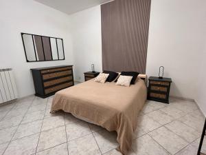 Ένα ή περισσότερα κρεβάτια σε δωμάτιο στο Appartement Cosy au coeur de l'Italie