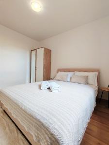Postel nebo postele na pokoji v ubytování Apartments Amare
