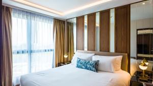 a bedroom with a bed and a large window at Apartment 2 bedrooms on Surin in Surin Beach +13 photos