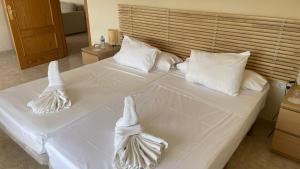 Postel nebo postele na pokoji v ubytování Hotel Algorfa