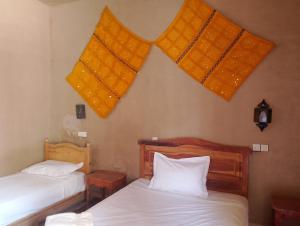 Postel nebo postele na pokoji v ubytování Hotel Riad Oasis