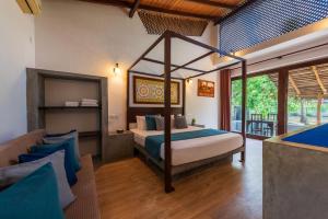 Postel nebo postele na pokoji v ubytování Queens Mount Tri Villas