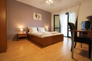 Ένα ή περισσότερα κρεβάτια σε δωμάτιο στο Apartments Frideric