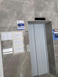 a mirror on a tiled floor next to a box at Tirana, Beautifull Apartament Near Mother Teresa Int Airport in Tirana +24 photos