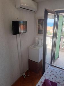 TV a/nebo společenská místnost v ubytování Guest House Romansa