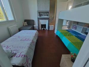 Rúm í herbergi á AMCP Gîte - Montgiscard