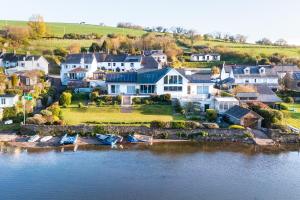 an aerial view of a large house on the water at Seaflowers in Kingsbridge