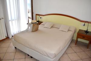 Postel nebo postele na pokoji v ubytování Ilios Residence