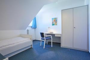 Postel nebo postele na pokoji v ubytování Gästehaus im LWH + 37 fotografií