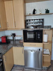A kitchen or kitchenette at Casa Amarela