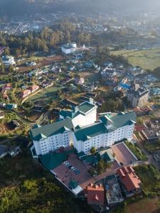 an aerial view of a city with buildings at Araliya Red - Lean Luxury - Where you find stunning 360 panoramic view of Nuwara Eliya in Nuwara Eliya
