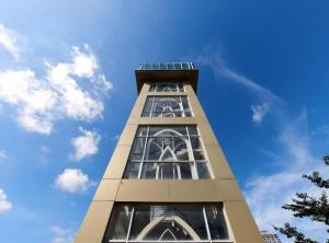 a tall building with windows on top of it at Paragon Nagoya Hotel Batam in Nagoya