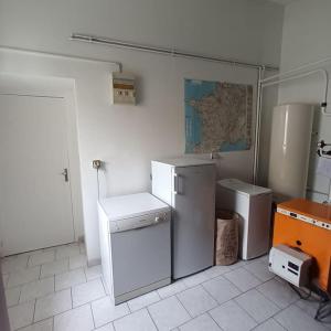 a kitchen with a refrigerator and a washer and dryer at Belle maison familiale près de La Rochelle in Ferrières +19 photos