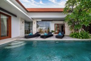 a swimming pool in the backyard of a villa at Best Place Near City Center and Batu Bolong Beach! - It's A 3BDR Villa with Private Pool in Canggu
