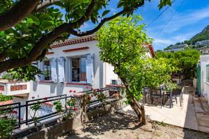 a white house with a tree in front of it at #54 Sea view Villa 4 BDR AC 5mins to Port BBQ in Nice