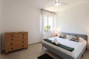 a bedroom with a bed with a dresser and a window at #54 Sea view Villa 4 BDR AC 5mins to Port BBQ in Nice