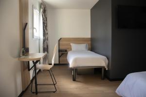 Voodi või voodid majutusasutuse B&B HOTEL Le Puy-en-Velay toas +37 fotot