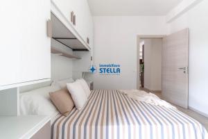 A bed or beds in a room at Condominio Trento