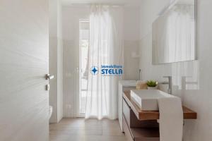 A bed or beds in a room at Condominio Trento