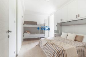 A bed or beds in a room at Condominio Trento
