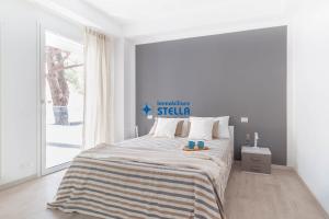 A bed or beds in a room at Condominio Trento