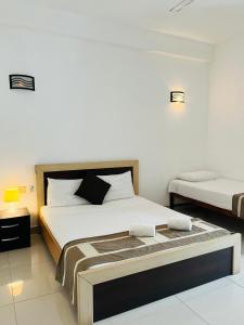 Postel nebo postele na pokoji v ubytování Hotel Blue Bird