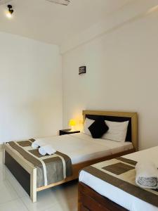 Postel nebo postele na pokoji v ubytování Hotel Blue Bird