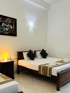 Postel nebo postele na pokoji v ubytování Hotel Blue Bird