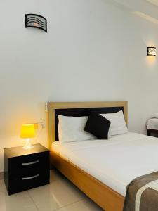Postel nebo postele na pokoji v ubytování Hotel Blue Bird