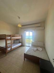 Ένα ή περισσότερα κρεβάτια σε δωμάτιο στο TANIA appartments