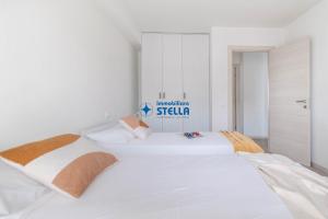 A bed or beds in a room at Condominio Trento