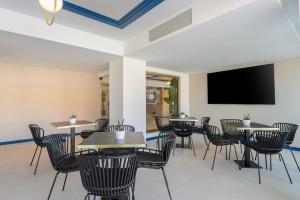 TV a/nebo společenská místnost v ubytování Hotel Vibra Palma Cactus