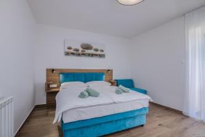 Postel nebo postele na pokoji v ubytování B&B Šegulja