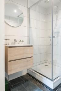 a bathroom with a shower and a sink at Newly Renovated With Fast Wifi, Near Poppodium013 in Tilburg