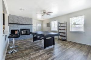 a living room with a piano and a fireplace at Cozy 3BR House Near Attractions & Shopping in Phoenix