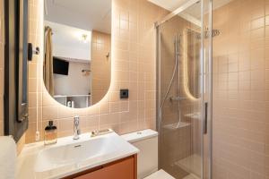 a bathroom with a sink and a shower at Hotel Robson - Smart Hotel in Lloret de Mar