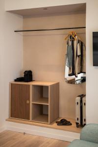 a room with a wooden cabinet in a room at Hotel Robson - Smart Hotel in Lloret de Mar