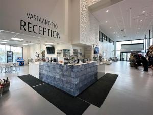 a lobby with a reception counter in a store at Seaside Glass Villas in Kemi
